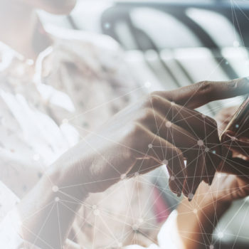 Woman using a phone in a car